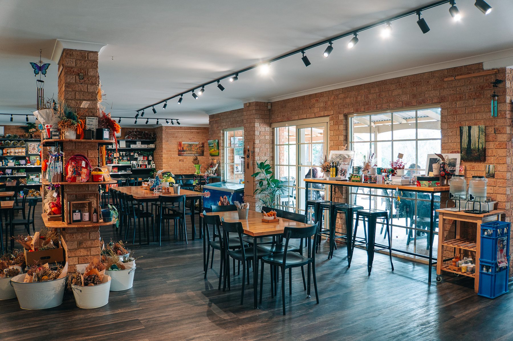Warm timber and exposed brick interior of Jarrahdale Local PO Kitchen